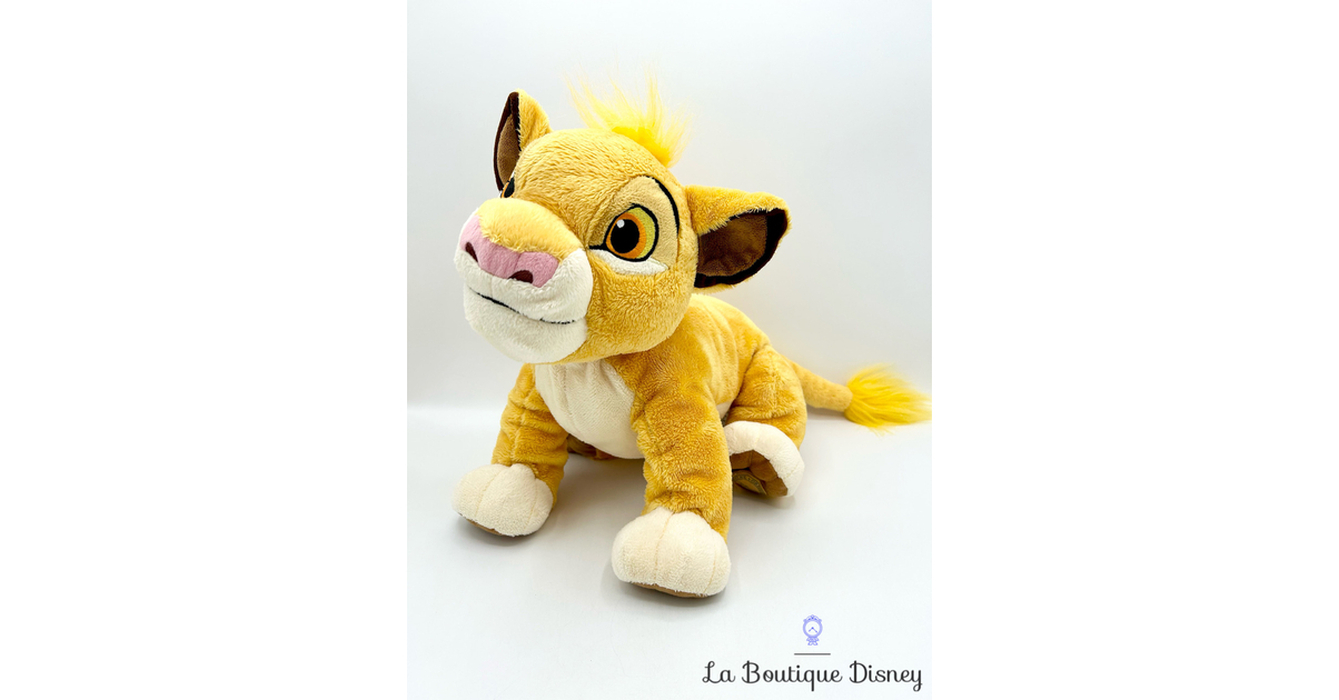 Peluche Simba Le roi lion Disney Store jaune écusson 35 cm - Peluches